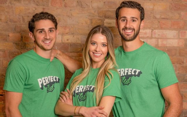A photo of PerfectTed's founders in branded T shirts standing in front of a brick wall. 